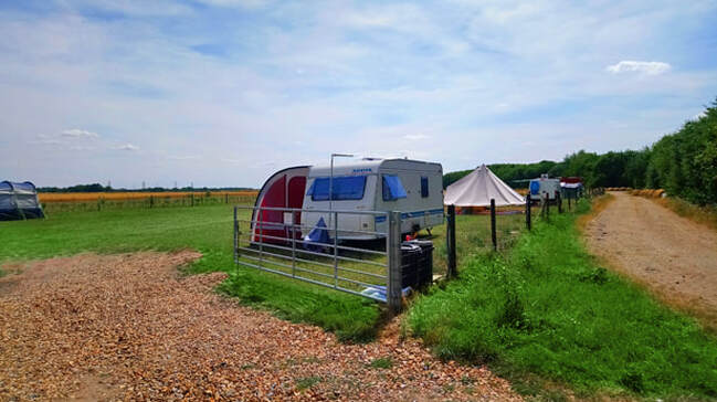 Caravan parked at our level grass site